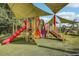 A colorful playground with shade structures and multiple play features at 10553 Bermuda Isle Dr, Tampa, FL 33647