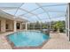 Relaxing screened pool and spa with brick deck at 10553 Bermuda Isle Dr, Tampa, FL 33647