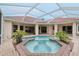 Octagonal pool and spa with a screened enclosure at 10553 Bermuda Isle Dr, Tampa, FL 33647