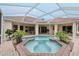 Octagon pool with spa, surrounded by lush landscaping at 10553 Bermuda Isle Dr, Tampa, FL 33647