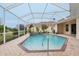 Relaxing pool and spa with screened enclosure at 10553 Bermuda Isle Dr, Tampa, FL 33647