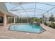 Inviting screened pool and spa with a tranquil setting at 10553 Bermuda Isle Dr, Tampa, FL 33647