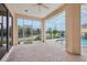 Spacious screened lanai with pool and lake views at 10553 Bermuda Isle Dr, Tampa, FL 33647