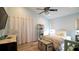 Bedroom with white bed frame, light blue walls, and built-in shelves at 10745 Bardes Ct, Seminole, FL 33777