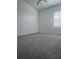 Spacious bedroom with ceiling fan and neutral carpeting at 10812 Fanning Springs Ct, Tampa, FL 33647