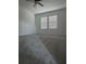 Spacious bedroom with grey carpet and ceiling fan at 10812 Fanning Springs Ct, Tampa, FL 33647