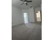 Large bedroom with carpet, ceiling fan, and ensuite bathroom at 10812 Fanning Springs Ct, Tampa, FL 33647