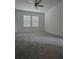 Spacious bedroom with grey carpet and ceiling fan at 10812 Fanning Springs Ct, Tampa, FL 33647