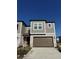 Two-story townhome with brown garage door and gray exterior at 10812 Fanning Springs Ct, Tampa, FL 33647