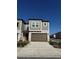 Two-story townhome with brown garage door and gray exterior at 10812 Fanning Springs Ct, Tampa, FL 33647