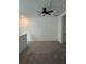 Spacious loft area with ceiling fan and carpet at 10812 Fanning Springs Ct, Tampa, FL 33647