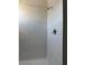 Simple shower with white tile and single shower head at 10812 Fanning Springs Ct, Tampa, FL 33647