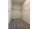 Bright walk-in closet with wire shelving at 10812 Fanning Springs Ct, Tampa, FL 33647