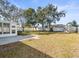 Large backyard with mature trees and fenced perimeter at 11013 Cranston St, Spring Hill, FL 34608