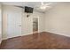 Spacious bedroom with wood-look flooring and ceiling fan at 11013 Cranston St, Spring Hill, FL 34608