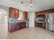 Modern kitchen with wood cabinets and granite countertops at 11013 Cranston St, Spring Hill, FL 34608