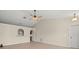 Living room featuring tile floors and a ceiling fan at 11013 Cranston St, Spring Hill, FL 34608