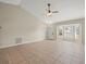 Bright living room with bay window and tile floors at 11013 Cranston St, Spring Hill, FL 34608