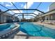 Large pool and spa with a screened patio at 11201 Lake Sassa Dr, Thonotosassa, FL 33592