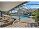 Inviting pool area with screened enclosure and patio furniture at 11201 Lake Sassa Dr, Thonotosassa, FL 33592