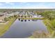 Aerial view of townhomes and a pond at 11220 Moultrie Pl, Tampa, FL 33625