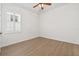 Simple bedroom with hardwood floors, plantation shutters and ceiling fan at 11220 Moultrie Pl, Tampa, FL 33625