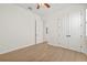 Bright bedroom with light wood floors and double closets at 11220 Moultrie Pl, Tampa, FL 33625