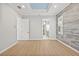 Bright bedroom with hardwood floors and en-suite bathroom at 11220 Moultrie Pl, Tampa, FL 33625