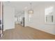 Bright dining room with hardwood floors and kitchen view at 11220 Moultrie Pl, Tampa, FL 33625