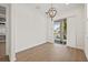 Elegant dining room with chandelier and access to a balcony at 11220 Moultrie Pl, Tampa, FL 33625