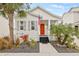 Charming single story home with orange door and landscaped yard at 11220 Moultrie Pl, Tampa, FL 33625