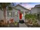 Charming house exterior at dusk with well-manicured landscaping at 11220 Moultrie Pl, Tampa, FL 33625