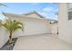 White garage door with ample parking space at 11220 Moultrie Pl, Tampa, FL 33625