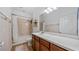 Bathroom featuring a long vanity with dark wood cabinets and a shower/tub combo at 11540 Balintore Dr, Riverview, FL 33579