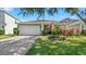 Charming single Gathering home with an attached two-car garage and beautiful landscaping at 11540 Balintore Dr, Riverview, FL 33579