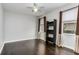 Bright bedroom with dark hardwood floors and built-in shelving at 11919 Royce Waterford Cir, Tampa, FL 33626