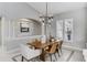 Elegant dining room with a modern chandelier at 11919 Royce Waterford Cir, Tampa, FL 33626