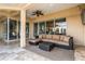 Covered patio with sectional sofa and views of the pool at 11919 Royce Waterford Cir, Tampa, FL 33626