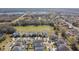 Aerial view of neighborhood, showing houses and a pond at 12119 Creek Preserve Dr, Riverview, FL 33579