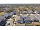 Aerial view of a neighborhood, showcasing houses and a large pond at 12119 Creek Preserve Dr, Riverview, FL 33579