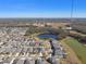 Aerial view of neighborhood with houses near a pond at 12119 Creek Preserve Dr, Riverview, FL 33579