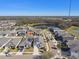 Aerial view of a residential neighborhood, showing houses and a pond at 12119 Creek Preserve Dr, Riverview, FL 33579