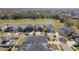 Aerial view of a residential area with houses and a pond at 12119 Creek Preserve Dr, Riverview, FL 33579