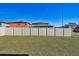 A backyard with a white vinyl fence and grass at 12119 Creek Preserve Dr, Riverview, FL 33579