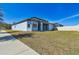 House's back with covered patio, fenced yard at 12119 Creek Preserve Dr, Riverview, FL 33579