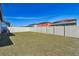 A backyard with a white vinyl fence and grass at 12119 Creek Preserve Dr, Riverview, FL 33579