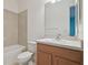 Bathroom with beige tile, tub, toilet and wood vanity at 12119 Creek Preserve Dr, Riverview, FL 33579