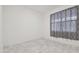 Spacious bedroom with large window and gray curtains at 12119 Creek Preserve Dr, Riverview, FL 33579