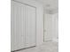 White closet doors in a bedroom with marble-look floors at 12119 Creek Preserve Dr, Riverview, FL 33579