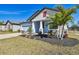 Newly built home with light blue exterior, landscaping, and a two-car garage at 12119 Creek Preserve Dr, Riverview, FL 33579